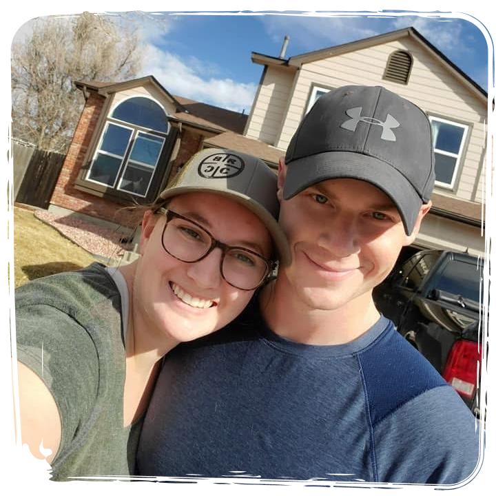 The Groeschels in front of their home.