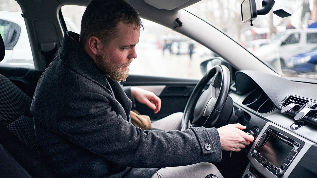 Man in driver seat of car