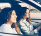 Group of young women in a car going for a drive