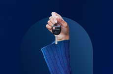 Bankrate awards 2024 auto loans banner featuring a hand holding a car key