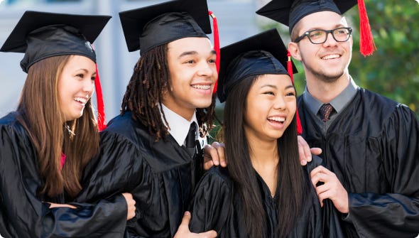 Four college students in black and red caps and gowns